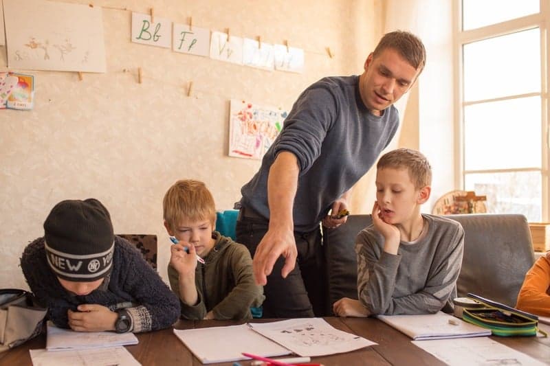 Teacher guiding students